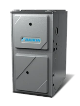 A gray metal Daikin furnace unit with a rectangular shape and two front access panels.