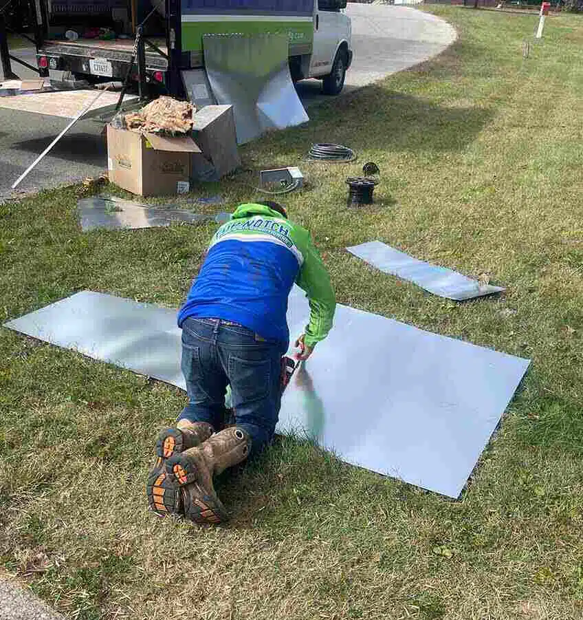 Top notch tech working on heat pump installation in BGKY.