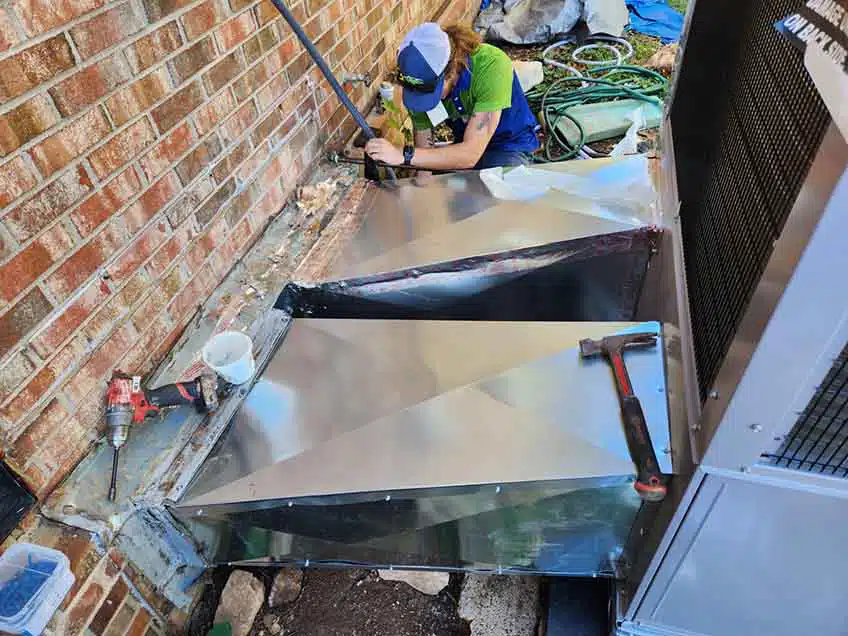 Heat pump system installation outside of residential building in BGKY.
