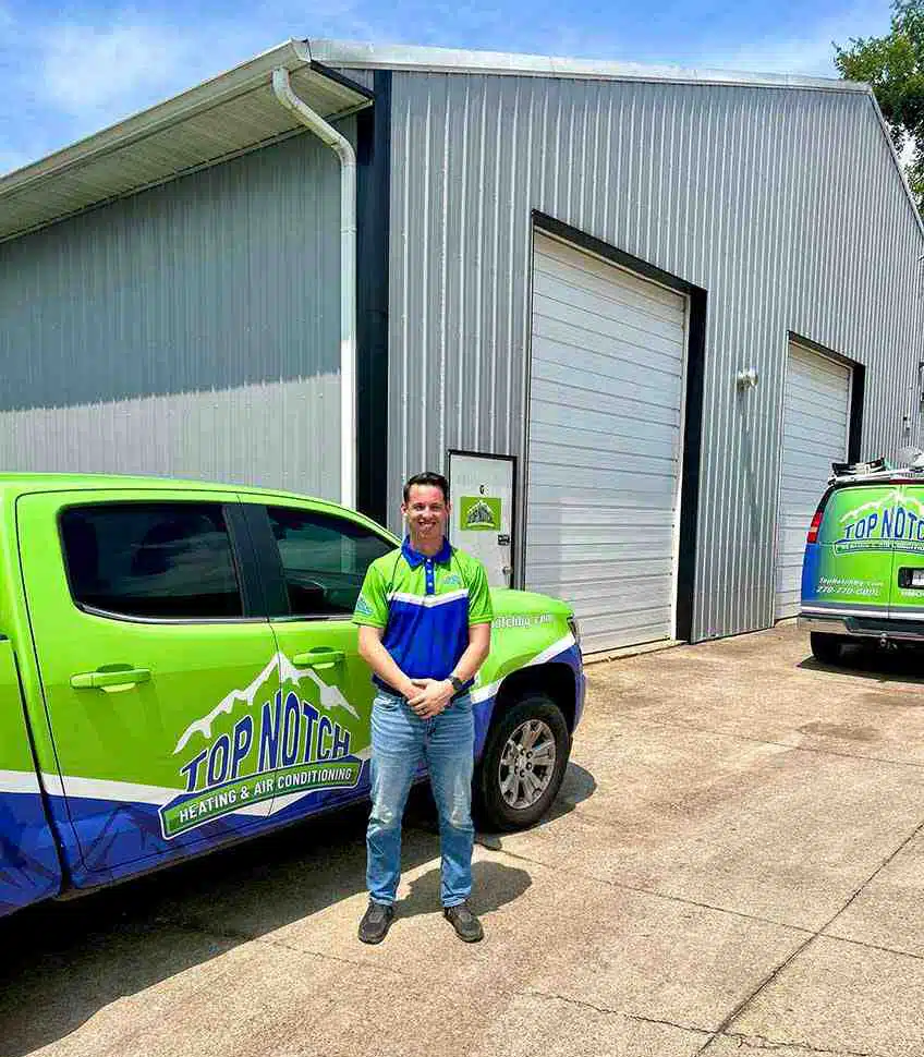 Service tech in front of top notch truck in BGKY.