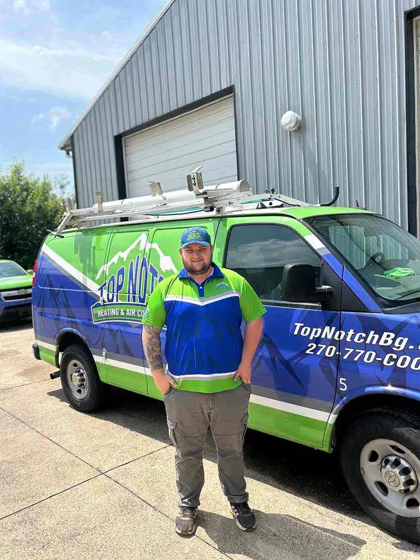Service technician in front of Top Notch van in BGKY.