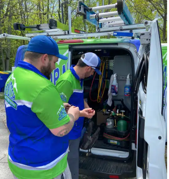Top Notch techs getting equipment out of van in Bowling Green, KY.